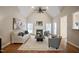 Inviting living room featuring a vaulted ceiling, fireplace, hardwood floors, and neutral tones, creating a cozy atmosphere at 4812 Cornoustie Ct, Holly Springs, NC 27540