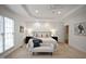 Elegant main bedroom with trey ceiling, neutral palette, and plush carpet at 4812 Cornoustie Ct, Holly Springs, NC 27540