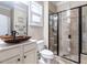 Modern bathroom features a glass-enclosed shower, and a vessel sink at 497 Rockport Dr, Clayton, NC 27527