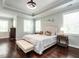 Spacious bedroom with a tray ceiling, wood floors, and great natural light at 497 Rockport Dr, Clayton, NC 27527