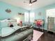 A cute bedroom is complete with a bed, desk, and hardwood flooring at 497 Rockport Dr, Clayton, NC 27527