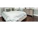 Comfortable bedroom features a plush bed, soft lighting, and a dresser with ample storage space at 497 Rockport Dr, Clayton, NC 27527