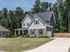 Beautiful two-story home featuring stone accents, a lush front yard, and an extended driveway at 497 Rockport Dr, Clayton, NC 27527
