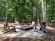 Inviting fire pit area with chairs, perfect for gatherings and enjoying the outdoors at 497 Rockport Dr, Clayton, NC 27527