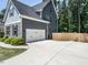 Attached two-car garage and large driveway offering ample parking at 497 Rockport Dr, Clayton, NC 27527