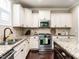 Gourmet kitchen with granite counters, island, stainless appliances and custom cabinets at 497 Rockport Dr, Clayton, NC 27527