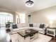 Spacious living room with comfortable seating, hardwood floors, and stylish decor at 497 Rockport Dr, Clayton, NC 27527