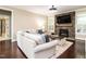 Cozy living room with stone fireplace, mounted TV, and comfortable seating area at 497 Rockport Dr, Clayton, NC 27527