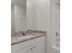 Modern bathroom with granite countertop vanity and a shower-tub combination at 505 Benton Dr, Oxford, NC 27565