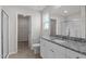 Modern bathroom with a granite vanity, a glass-enclosed shower, and a walk-in closet at 507 Benton Dr, Oxford, NC 27565