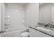 Bathroom with granite sink, shower, bathtub, and toilet in a modern, well-lit space at 507 Benton Dr, Oxford, NC 27565
