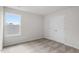 Bedroom features neutral carpet, natural light from a window, and a spacious closet at 507 Benton Dr, Oxford, NC 27565