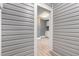 Mudroom featuring vinyl siding and vinyl flooring, opening into another room at 518 Avon Ave, Burlington, NC 27215