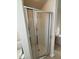A glass shower door creates a sleek feel in this bright bathroom at 523 Berry Chase Way, Cary, NC 27519