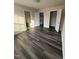 An airy bedroom with three doorways and modern flooring at 523 Berry Chase Way, Cary, NC 27519