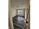 A bright bedroom featuring modern flooring and windows for natural light at 523 Berry Chase Way, Cary, NC 27519