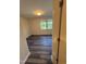 Well-lit bedroom with sleek flooring and a view of the outdoors through bright windows at 523 Berry Chase Way, Cary, NC 27519