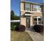 Charming brick front exterior featuring brown shutters and a covered entryway with the house number 523 at 523 Berry Chase Way, Cary, NC 27519