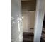 A compact laundry closet featuring new flooring, a wall-mounted shelf, and plumbing hookups at 523 Berry Chase Way, Cary, NC 27519