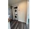 A modern laundry room features a stacked washer and dryer for space-saving efficiency at 523 Berry Chase Way, Cary, NC 27519