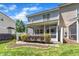 Landscaped backyard featuring healthy green grass, a decorative border, and a screened porch at 534 Elm Ave, Wake Forest, NC 27587