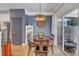 Cozy dining area featuring a wooden table with four chairs adjacent to a sliding glass door at 534 Elm Ave, Wake Forest, NC 27587