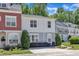 Charming townhouse with landscaped front yard and manicured bushes, featuring a neutral color scheme and inviting curb appeal at 534 Elm Ave, Wake Forest, NC 27587