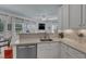 Well-appointed kitchen area with modern appliances, a stainless steel dishwasher, and easy access to dining at 534 Elm Ave, Wake Forest, NC 27587