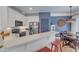 Kitchen featuring stainless steel appliances, a breakfast bar, and seamless flow into the dining area at 534 Elm Ave, Wake Forest, NC 27587