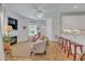Bright living room featuring neutral decor, a warm fireplace, terra cotta tile floors and a seamless entry door at 534 Elm Ave, Wake Forest, NC 27587