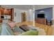 Open concept living area showcases built-in cabinetry, wood floors, and comfortable furniture at 534 Elm Ave, Wake Forest, NC 27587