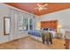 Inviting main bedroom featuring a colorful headboard, natural light, and terracotta tile floors at 534 Elm Ave, Wake Forest, NC 27587