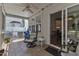 Inviting screened porch with tile flooring, ceiling fan, and access to the home's interior at 534 Elm Ave, Wake Forest, NC 27587