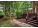 Picturesque backyard view with a brick patio and lush greenery, perfect for outdoor relaxation and entertaining at 541 The Preserve Trail Trl, Chapel Hill, NC 27517