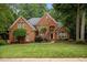 Charming two-story brick home with lush landscaping and a welcoming front entrance at 541 The Preserve Trail Trl, Chapel Hill, NC 27517