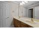 Bright Primary bathroom featuring double sinks, a large vanity, and two doors at 541 The Preserve Trl, Chapel Hill, NC 27517