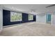 This expansive bedroom features a neutral carpet, a ceiling fan, and lots of natural light from the two windows at 541 The Preserve Trl, Chapel Hill, NC 27517