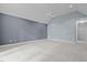 Spacious bedroom with neutral carpeting, a ceiling fan, and access to a hallway at 541 The Preserve Trl, Chapel Hill, NC 27517