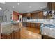 Gourmet kitchen with stainless steel appliances, granite countertops, and custom cabinetry at 541 The Preserve Trl, Chapel Hill, NC 27517