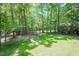 Spacious backyard with mature trees at 5601 Jomali Dr, Durham, NC 27705