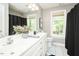 Bathroom featuring a double vanity, tile flooring, and a shower with a curtain at 5601 Jomali Dr, Durham, NC 27705