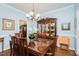 Elegant dining room featuring a classic china cabinet and ample seating for Gathering gatherings at 5601 Jomali Dr, Durham, NC 27705