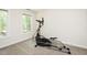Home gym featuring an elliptical machine and natural light from the windows at 5601 Jomali Dr, Durham, NC 27705