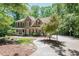 Charming brick home with landscaped yard, long driveway, and basketball court at 5601 Jomali Dr, Durham, NC 27705