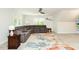 Inviting living room with a comfortable sectional sofa, ceiling fan, and plenty of natural light at 5601 Jomali Dr, Durham, NC 27705