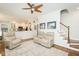 Open concept living room area featuring access to kitchen, living area, and stairs to upper levels at 5601 Jomali Dr, Durham, NC 27705