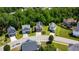 Aerial view of the neighborhood and homes surrounded by lush greenery at 5865 Forest Point Rd Rd, Raleigh, NC 27610