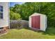 The backyard has a storage shed with a red door and a wooden fence at 5865 Forest Point Rd Rd, Raleigh, NC 27610