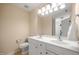 Bright bathroom featuring a double sink vanity with white cabinetry and neutral walls at 5865 Forest Point Rd Rd, Raleigh, NC 27610