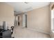 Empty room featuring neutral carpet, and multiple doors at 5865 Forest Point Rd Rd, Raleigh, NC 27610